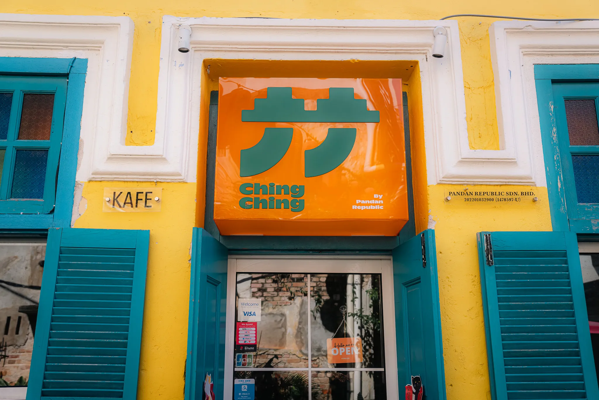 Ching Ching cafe entrance, Kuala Lumpur, with distinctive orange signage