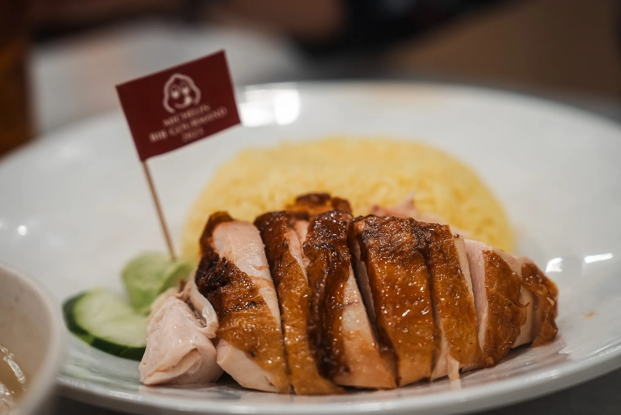 Hainanese chicken rice with Michelin Bib Gourmand flag at Nam Heong Chicken Rice, Kuala Lumpur