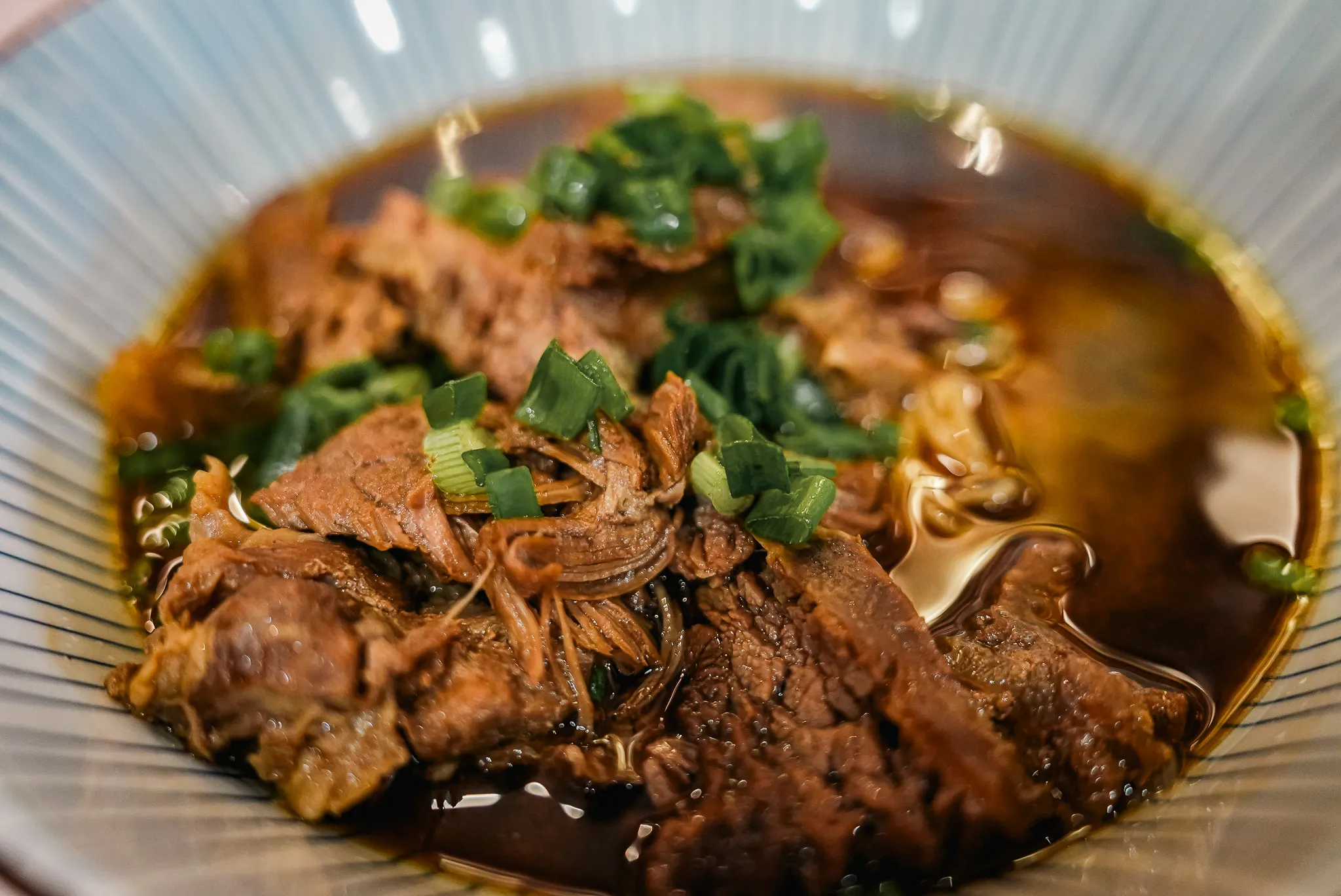Close-up of beef noodles with tender beef and rich broth at Kim Yong Gee, Kuala Lumpur