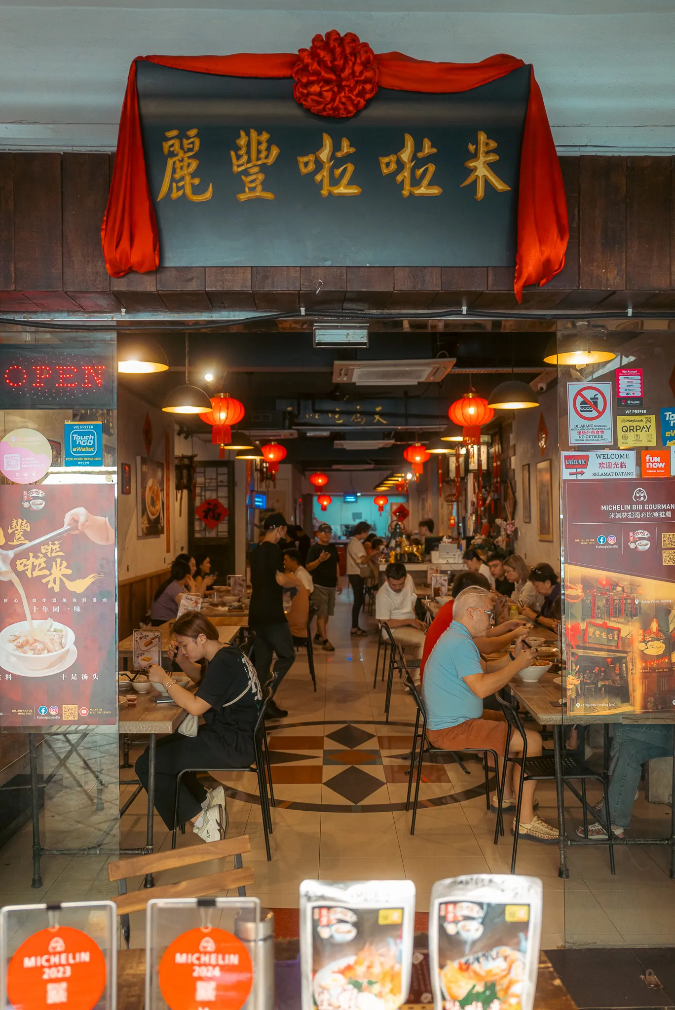 Bustling interior of Lai Foong Lala Noodles, Kuala Lumpur, with Michelin Bib Gourmand signage