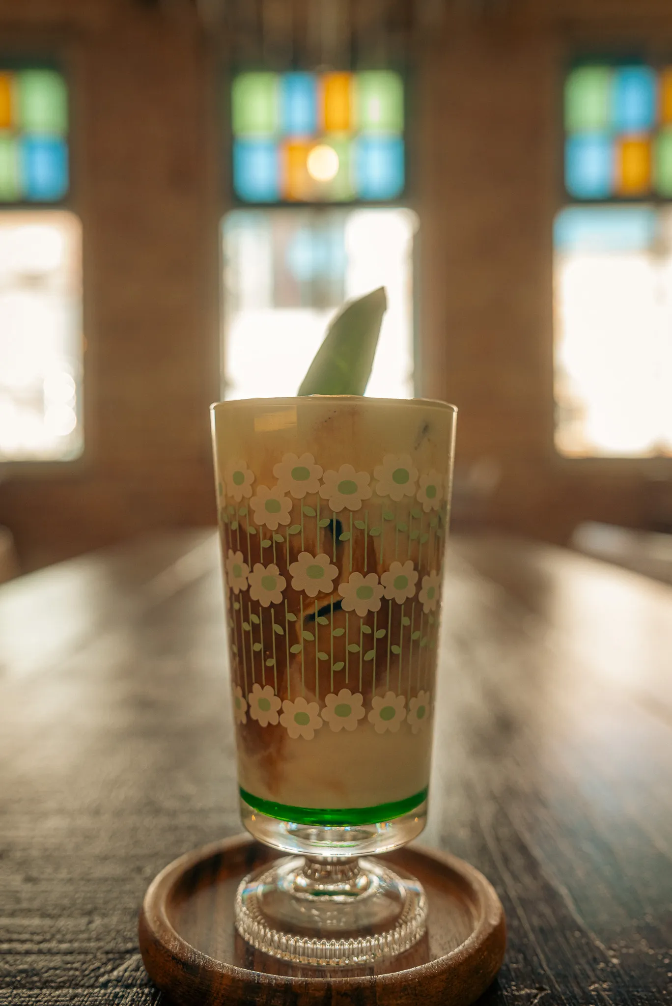 Pandan latte in a decorative glass at Ching Ching by Pandan Republic, Kuala Lumpur